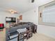 Cozy living room featuring a large sectional sofa, ceiling fan and decor at 9891 52Nd N St, Pinellas Park, FL 33782