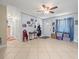 Bright living area featuring neutral tile flooring and large window for natural light at 9891 52Nd N St, Pinellas Park, FL 33782