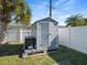 Backyard gray shed providing additional outdoor storage space at 9891 52Nd N St, Pinellas Park, FL 33782