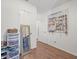 Bright walk-in closet with hardwood floors, mirror, and ample storage at 9891 52Nd N St, Pinellas Park, FL 33782