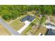 Aerial view of home showing a long driveway leading to a modern style ranch home at 10380 Yellow Hammer Rd, Weeki Wachee, FL 34614