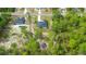 New construction single Gathering home nestled in a wooded area with long driveway and lawn at 10380 Yellow Hammer Rd, Weeki Wachee, FL 34614