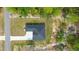 Aerial view showcasing the property's well-maintained landscaping and convenient driveway access at 10380 Yellow Hammer Rd, Weeki Wachee, FL 34614