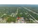 New construction single Gathering home surrounded by trees with highway in the distance at 10380 Yellow Hammer Rd, Weeki Wachee, FL 34614
