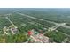 New single Gathering home in a residential area with trees and highway in the background at 10380 Yellow Hammer Rd, Weeki Wachee, FL 34614