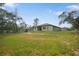 Expansive backyard offering plenty of space for outdoor activities and featuring a fenced perimeter at 10380 Yellow Hammer Rd, Weeki Wachee, FL 34614