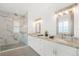 Elegant bathroom with double vanity, granite countertops, and a marble-walled walk-in shower at 10380 Yellow Hammer Rd, Weeki Wachee, FL 34614