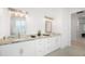 Spacious bathroom featuring a double vanity, granite countertops, and modern fixtures and lighting at 10380 Yellow Hammer Rd, Weeki Wachee, FL 34614