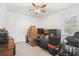Bedroom with boxes, storage containers, and a window with plantation shutters at 10380 Yellow Hammer Rd, Weeki Wachee, FL 34614
