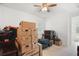 Bright bedroom filled with storage boxes and natural light from the window at 10380 Yellow Hammer Rd, Weeki Wachee, FL 34614