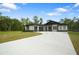 Beautiful single story house with large driveway, well-kept lawn and mature landscaping at 10380 Yellow Hammer Rd, Weeki Wachee, FL 34614