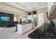 Modern open floor plan with an island kitchen and view of the living room and lanai at 10380 Yellow Hammer Rd, Weeki Wachee, FL 34614