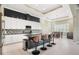 Bright kitchen with modern countertops, island with seating, stainless steel appliances and stylish backsplash at 10380 Yellow Hammer Rd, Weeki Wachee, FL 34614