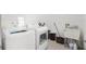 Functional laundry room equipped with a washer, dryer, and utility sink at 10380 Yellow Hammer Rd, Weeki Wachee, FL 34614
