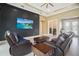 Staged living room with sliders to the lanai, open floor plan, and neutral color palette at 10380 Yellow Hammer Rd, Weeki Wachee, FL 34614