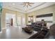 Open floor plan with staged living room that flows into the modern kitchen at 10380 Yellow Hammer Rd, Weeki Wachee, FL 34614