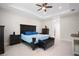 Spacious main bedroom with tray ceilings, ceiling fan, and an entertainment center at 10380 Yellow Hammer Rd, Weeki Wachee, FL 34614