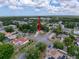 An aerial view showing the home is surrounded by mature trees and in a quiet neighborhood at 10411 Ireland St, Spring Hill, FL 34608