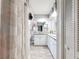 Well-lit bathroom with white cabinets, double sinks, modern finishes, and a shower/tub combination at 10411 Ireland St, Spring Hill, FL 34608