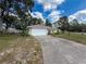 Charming single-story home with a well-manicured lawn and attached two-car garage at 10411 Ireland St, Spring Hill, FL 34608