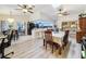 Open floor plan with breakfast nook, kitchen bar, dining room, and seamless flow to other spaces at 10411 Ireland St, Spring Hill, FL 34608