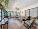 Florida room complete with updated furniture, decor and well lit natural lighting at 10411 Ireland St, Spring Hill, FL 34608