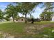 The exterior view shows the backyard and screened in pool area at 10441 Mayflower Rd, Spring Hill, FL 34608