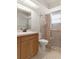 Bathroom with shower and glass door, and a large mirror above a sink at 10441 Mayflower Rd, Spring Hill, FL 34608
