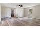 Bedroom featuring new floors, ceiling fan, and a closet at 10441 Mayflower Rd, Spring Hill, FL 34608