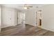 Neutral bedroom featuring new floors, ceiling fan, and closet at 10441 Mayflower Rd, Spring Hill, FL 34608
