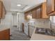 Efficient kitchen features ample cabinet storage, smooth countertops, and white appliances at 10441 Mayflower Rd, Spring Hill, FL 34608