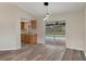 Bright dining area adjacent to the kitchen features new flooring and sliding glass doors to backyard at 10441 Mayflower Rd, Spring Hill, FL 34608