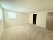 Spacious bedroom with carpet and window, ready for personalization at 11034 Harding Dr, Port Richey, FL 34668