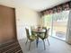 Cozy dining area with table set and large window, ideal for Gathering meals at 11034 Harding Dr, Port Richey, FL 34668