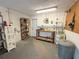 Functional garage space with storage and a workbench at 11034 Harding Dr, Port Richey, FL 34668