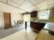 Eat-in kitchen with modern appliances and sliding glass doors to the backyard at 11034 Harding Dr, Port Richey, FL 34668