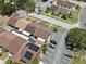 Organized townhome community featuring dedicated parking, energy-efficient solar panels, and well-maintained green spaces from above at 11402 Shallowbrook Pl, Tampa, FL 33624