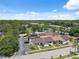 Wide aerial view of residential community featuring trees, lakes, and nearby roadways at 11402 Shallowbrook Pl, Tampa, FL 33624