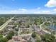 Wide aerial view of residential community featuring landscaping, lakes, and highways at 11402 Shallowbrook Pl, Tampa, FL 33624