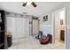 Bedroom featuring tile floors, large closet and ensuite bathroom at 11402 Shallowbrook Pl, Tampa, FL 33624