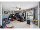 Bedroom with a bunk bed, tiled floors, and a ceiling fan at 11402 Shallowbrook Pl, Tampa, FL 33624