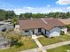 Inviting townhome featuring neat landscaping, a private front patio, dedicated parking, and a well-maintained exterior at 11402 Shallowbrook Pl, Tampa, FL 33624