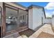 Exterior of home showing screened patio, paver area, and white privacy fence at 11402 Shallowbrook Pl, Tampa, FL 33624