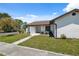 Charming single-story home with neat landscaping and an inviting walkway at 11402 Shallowbrook Pl, Tampa, FL 33624