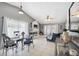 Open-concept living room featuring a fireplace, tile flooring, and sliding glass doors at 11402 Shallowbrook Pl, Tampa, FL 33624