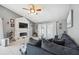 Bright living room with tile floors, vaulted ceilings, fireplace, and comfortable seating at 11402 Shallowbrook Pl, Tampa, FL 33624