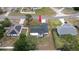 Aerial view of a well-maintained neighborhood with a home in the center at 11494 Villa Rd, Spring Hill, FL 34609