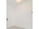Bright entryway showcases a modern white door, marble floors, and a contemporary aesthetic at 11494 Villa Rd, Spring Hill, FL 34609