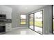 Kitchen nook with views to the yard and access to backyard via sliding glass doors at 11494 Villa Rd, Spring Hill, FL 34609