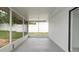 Covered and screened-in porch area featuring neutral tones at 11494 Villa Rd, Spring Hill, FL 34609